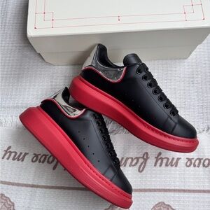 Alexander Mcqueen Black Leather Sneakers With Red And Silver Accents